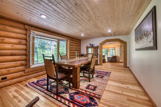 1062 Bear Creek Trl, Victor, MT 59875 - dining space featuring wooden ceiling, log walls, plenty of natural light, recessed lighting, and light wood-type flooring