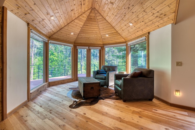 1062 Bear Creek Trl, Victor, MT 59875 - living room with healthy amount of natural light, wood ceiling, light wood-style flooring, and vaulted ceiling