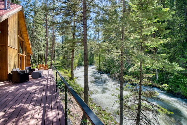 1062 Bear Creek Trl, Victor, MT 59875 - deck with an outdoor hangout area and a forest view