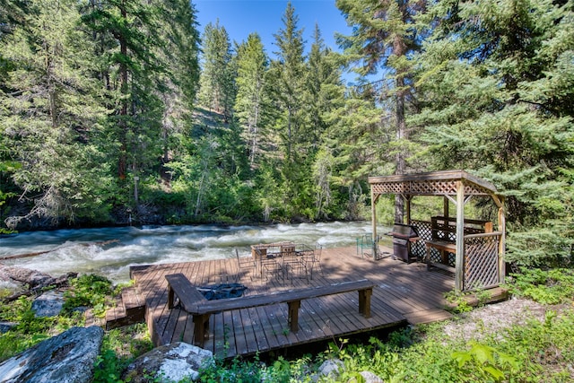 1062 Bear Creek Trl, Victor, MT 59875 - wooden terrace featuring a view of trees and grilling area