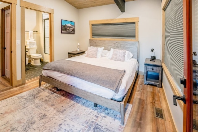 1331 Nelson Lane Cabins H & I, Whitefish, MT 59937 - bedroom with wood finished floors, baseboards, and ensuite bathroom