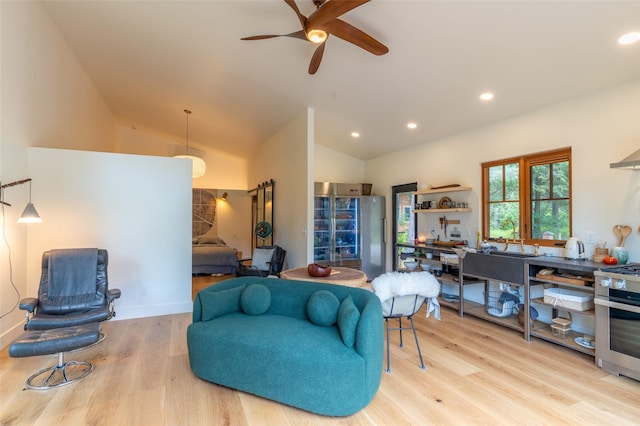 135 Gamma Rd, Hungry Horse, MT 59919 - living room with light wood-style flooring, ceiling fan, vaulted ceiling, and recessed lighting