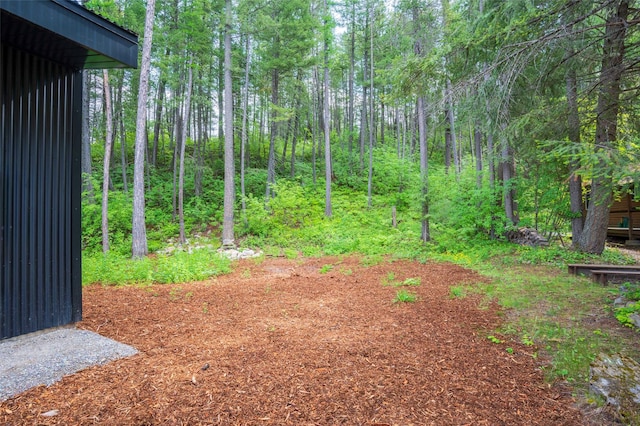 135 Gamma Rd, Hungry Horse, MT 59919 - view of yard with a view of trees