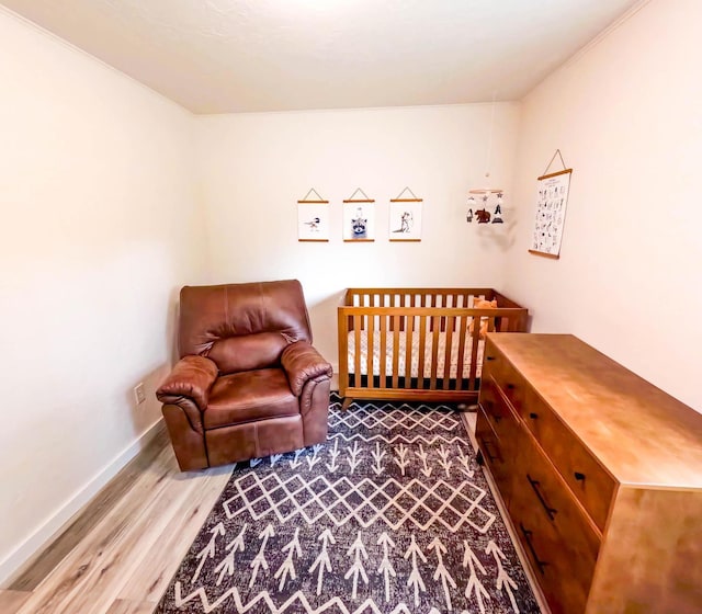 1203 1st St E, Polson, MT 59860 - bedroom with wood finished floors and baseboards