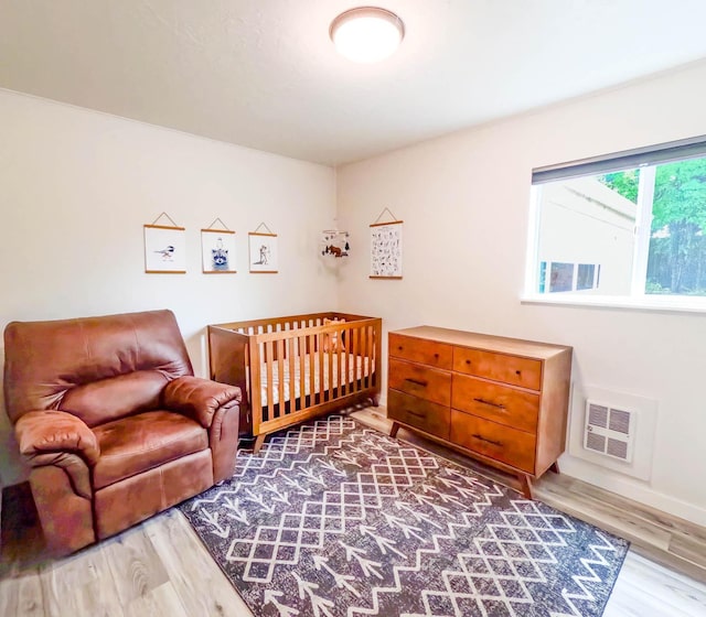 1203 1st St E, Polson, MT 59860 - bedroom featuring wood finished floors and baseboards