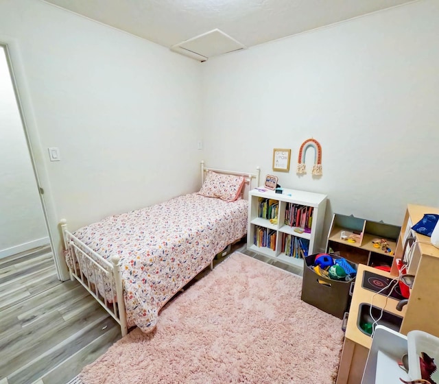1203 1st St E, Polson, MT 59860 - bedroom with attic access and wood finished floors
