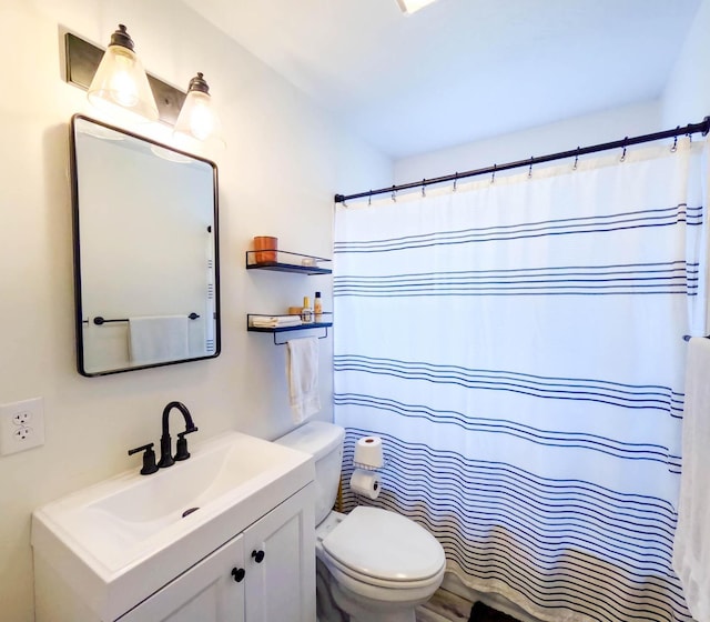 1203 1st St E, Polson, MT 59860 - bathroom with toilet, vanity, and a shower with curtain