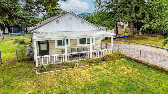 1203 1st St E, Polson, MT 59860 - view of front of house with metal roof and covered porch