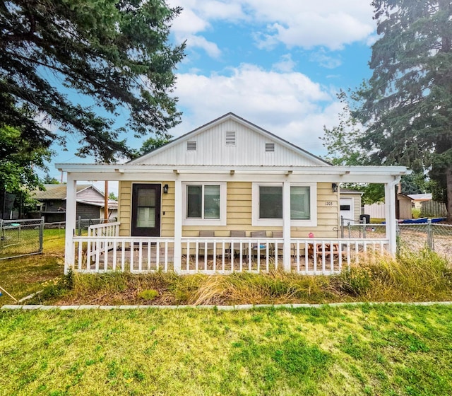 1203 1st St E, Polson, MT 59860 - rear view of house with board and batten siding