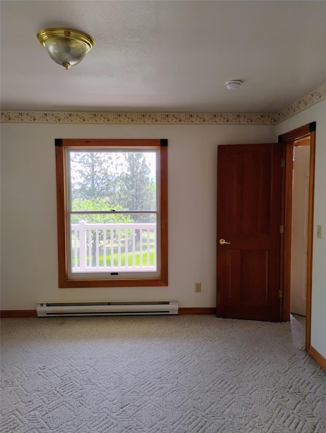 5 Pronghorn Dr, Clancy, MT 59634 - spare room with a baseboard heating unit, light colored carpet, and a smoke detector