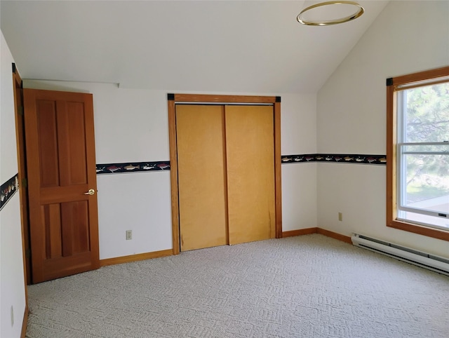 5 Pronghorn Dr, Clancy, MT 59634 - unfurnished bedroom with lofted ceiling, light carpet, a baseboard heating unit, and a closet