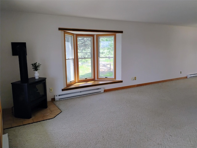 5 Pronghorn Dr, Clancy, MT 59634 - unfurnished living room with baseboard heating, carpet, and a wood stove