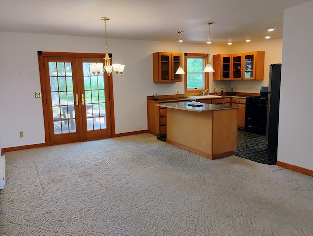 5 Pronghorn Dr, Clancy, MT 59634 - kitchen with black gas range oven, glass insert cabinets, light colored carpet, and recessed lighting