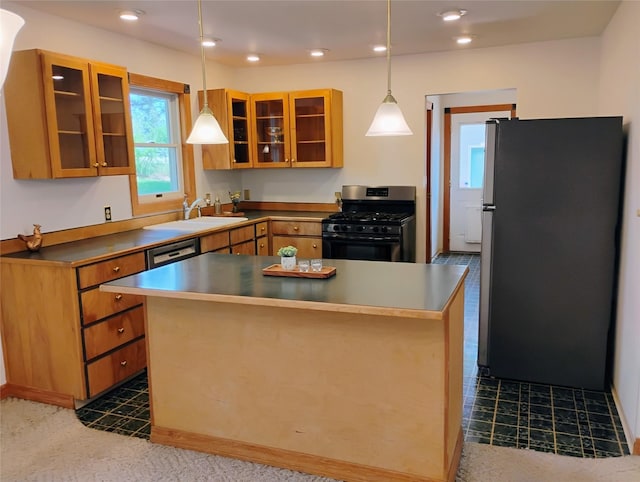 5 Pronghorn Dr, Clancy, MT 59634 - kitchen with stainless steel appliances, glass insert cabinets, hanging light fixtures, recessed lighting, and brown cabinets