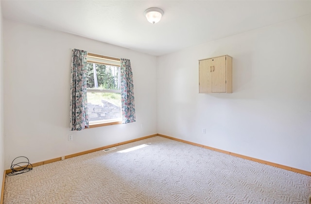 1065 Evergreen Dr, Seeley Lake, MT 59868 - unfurnished room with baseboards and carpet floors