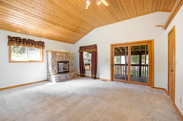 1065 Evergreen Dr, Seeley Lake, MT 59868 - unfurnished living room featuring wood ceiling, vaulted ceiling, carpet flooring, and a fireplace