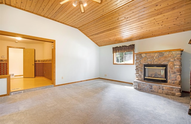 1065 Evergreen Dr, Seeley Lake, MT 59868 - unfurnished living room with wood ceiling, a fireplace, ceiling fan, vaulted ceiling, and carpet flooring
