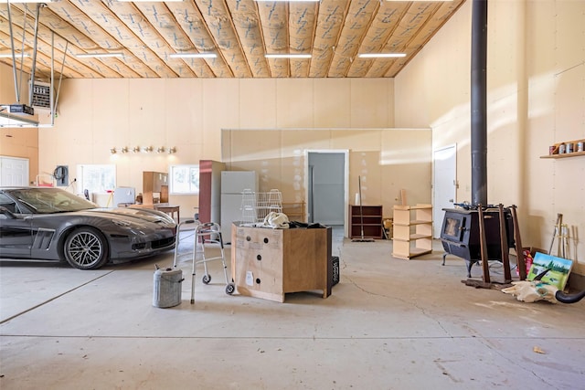 1065 Evergreen Dr, Seeley Lake, MT 59868 - garage featuring a wood stove and a heating unit