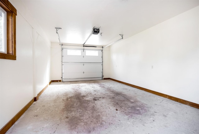 1065 Evergreen Dr, Seeley Lake, MT 59868 - garage featuring a garage door opener and baseboards