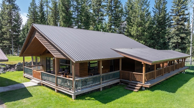 1065 Evergreen Dr, Seeley Lake, MT 59868 - rear view of house featuring a yard and metal roof