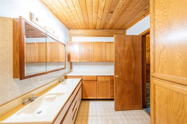 137 Amber Rd, Troy, MT 59935 - bathroom featuring tile patterned floors, wooden ceiling, vanity, and tasteful backsplash