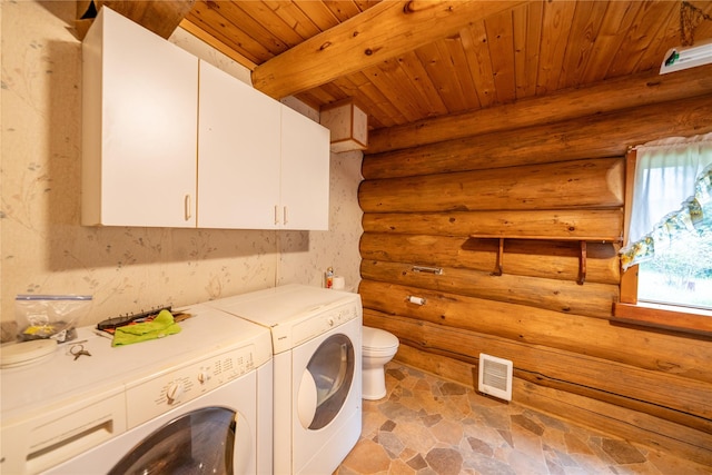 137 Amber Rd, Troy, MT 59935 - laundry room featuring wood ceiling, log walls, washing machine and dryer, and light stone finish floors