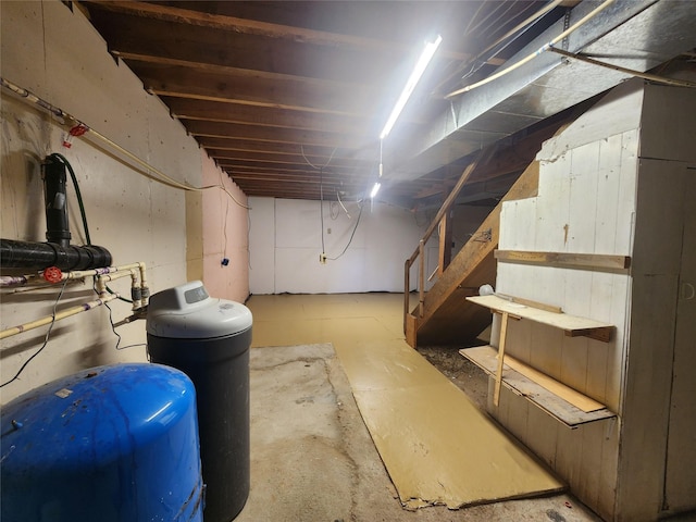 137 Amber Rd, Troy, MT 59935 - unfinished basement featuring stairway and a water pressure tank