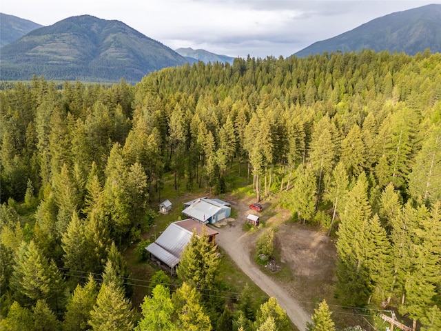 137 Amber Rd, Troy, MT 59935 - aerial view of property and surrounding area with a heavily wooded area and a mountainous background