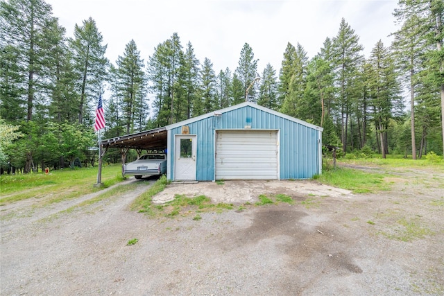 137 Amber Rd, Troy, MT 59935 - garage featuring a garage and dirt driveway