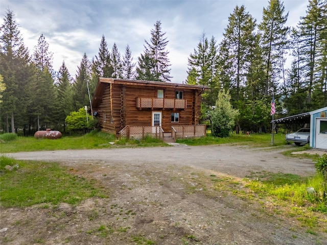 137 Amber Rd, Troy, MT 59935 - view of front of property featuring log exterior and dirt driveway
