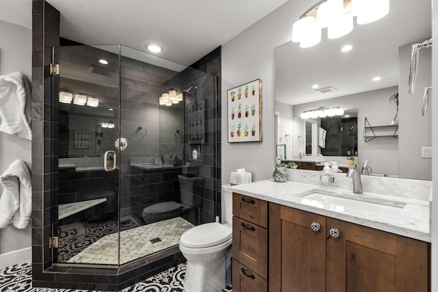 309 Fairway Dr, Whitefish, MT 59937 - bathroom featuring vanity, a shower stall, and recessed lighting