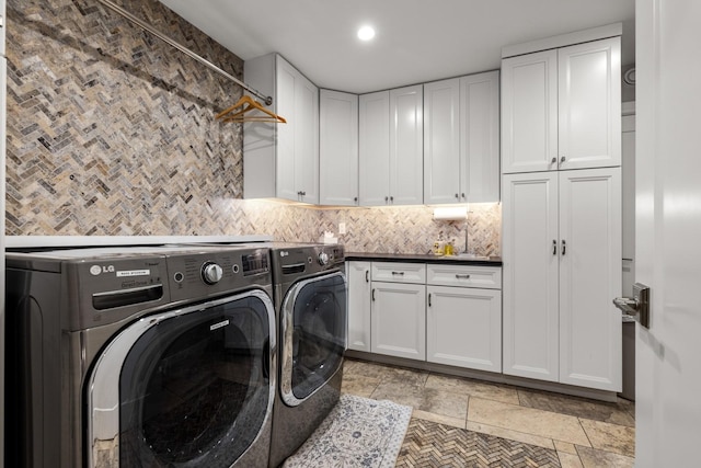 309 Fairway Dr, Whitefish, MT 59937 - laundry area with washer and clothes dryer, cabinet space, recessed lighting, and stone tile floors