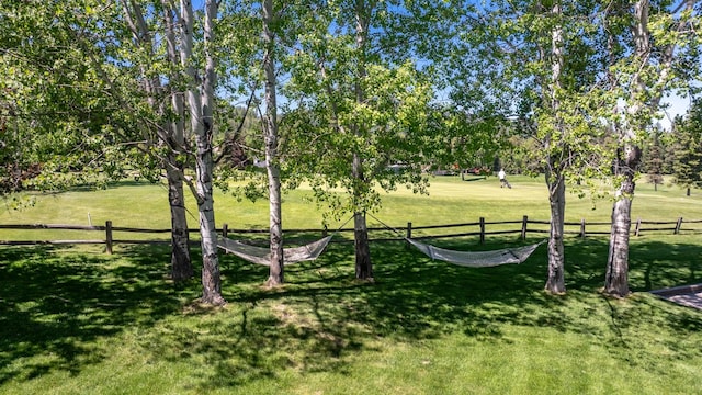 309 Fairway Dr, Whitefish, MT 59937 - view of yard featuring view of wooded area