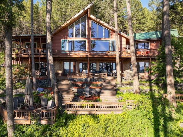 14690 Shore Acres Dr, Bigfork, MT 59911 - rear view of property with stairs and a deck