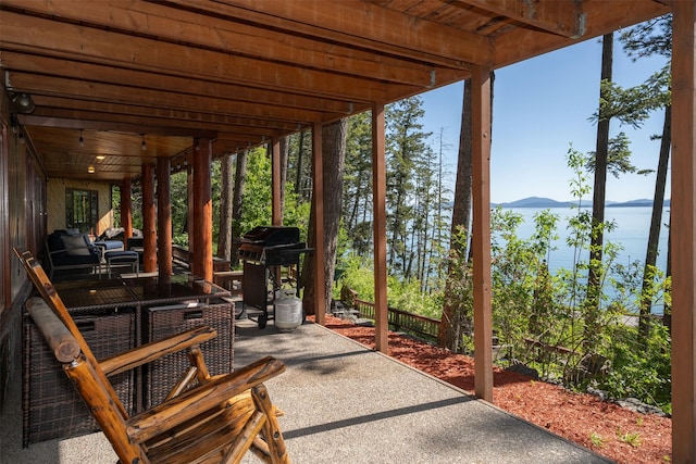 14690 Shore Acres Dr, Bigfork, MT 59911 - view of patio featuring a mountain view and a grill