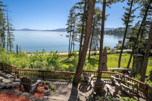 14690 Shore Acres Dr, Bigfork, MT 59911 - wooden terrace with a water and mountain view