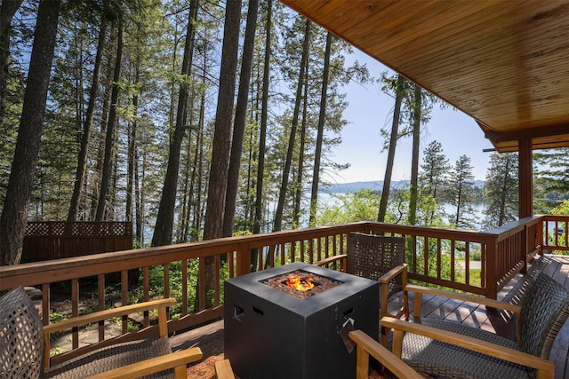 14690 Shore Acres Dr, Bigfork, MT 59911 - deck featuring an outdoor fire pit
