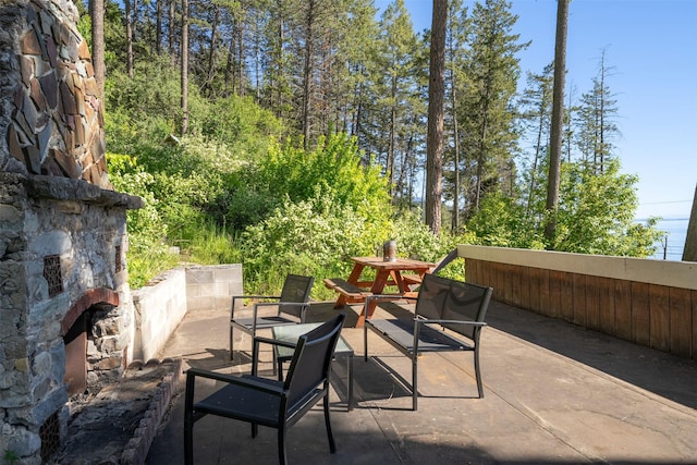 14690 Shore Acres Dr, Bigfork, MT 59911 - view of patio with an outdoor stone fireplace