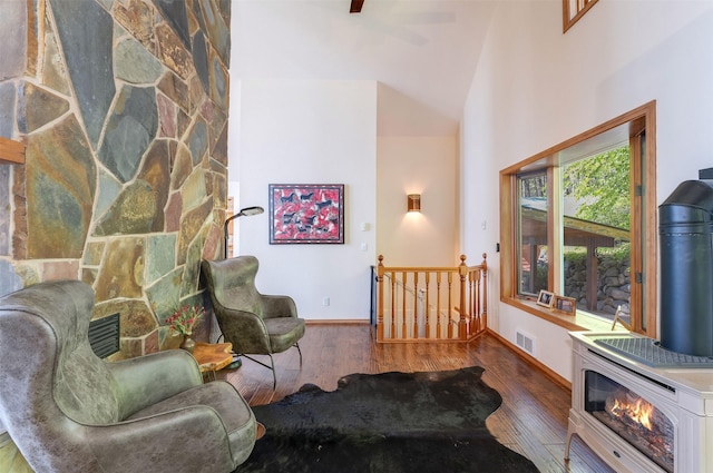 14690 Shore Acres Dr, Bigfork, MT 59911 - sitting room with wood finished floors, an upstairs landing, baseboards, and high vaulted ceiling