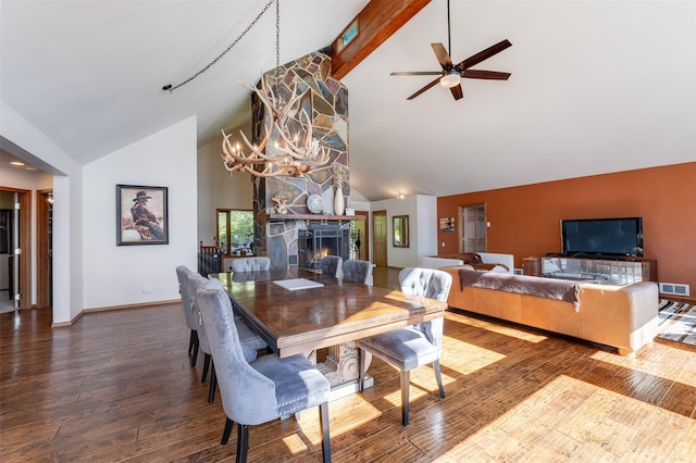 14690 Shore Acres Dr, Bigfork, MT 59911 - dining space featuring high vaulted ceiling, baseboards, wood finished floors, a fireplace, and ceiling fan