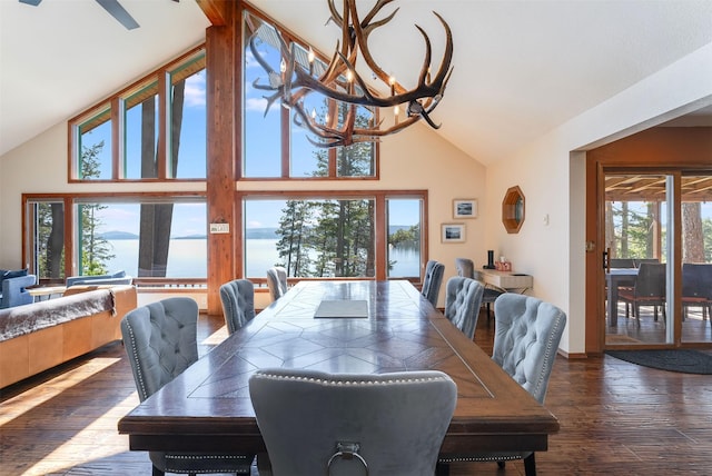 14690 Shore Acres Dr, Bigfork, MT 59911 - dining space featuring wood-type flooring, high vaulted ceiling, and a chandelier