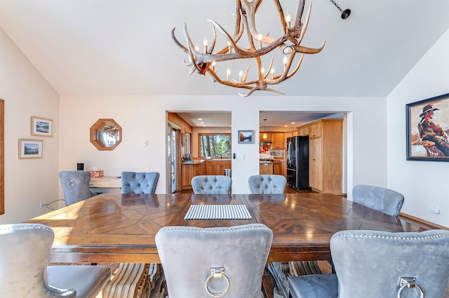 14690 Shore Acres Dr, Bigfork, MT 59911 - dining room featuring lofted ceiling and a chandelier