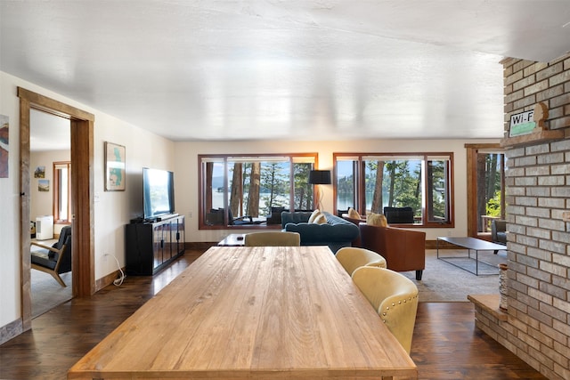 14690 Shore Acres Dr, Bigfork, MT 59911 - dining room with dark wood-type flooring and baseboards