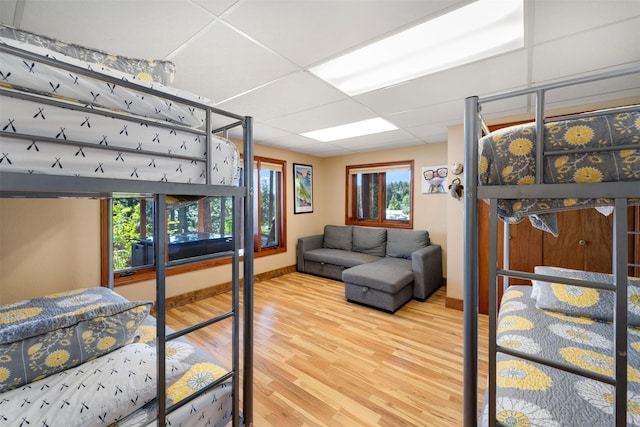 14690 Shore Acres Dr, Bigfork, MT 59911 - bedroom with wood finished floors and multiple windows