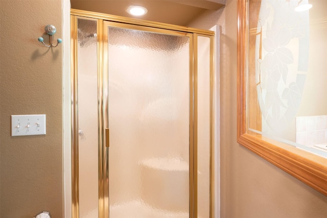 14690 Shore Acres Dr, Bigfork, MT 59911 - full bath featuring a shower stall and a textured wall
