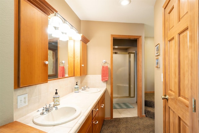 14690 Shore Acres Dr, Bigfork, MT 59911 - full bath featuring a shower stall, double vanity, and decorative backsplash