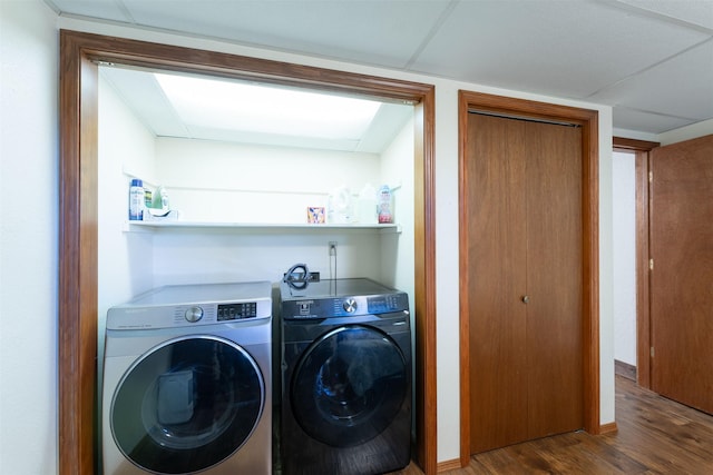 14690 Shore Acres Dr, Bigfork, MT 59911 - laundry room featuring washing machine and dryer and wood finished floors