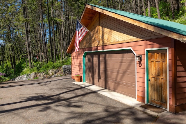 14690 Shore Acres Dr, Bigfork, MT 59911 - detached garage featuring a forest view