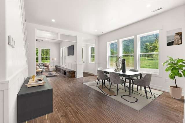 189 Blue Creek Rd, Heron, MT 59844 - dining area with a decorative wall, dark wood-type flooring, a wainscoted wall, and recessed lighting