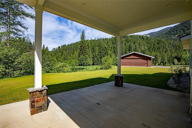 189 Blue Creek Rd, Heron, MT 59844 - view of patio / terrace with a view of trees and a mountain view